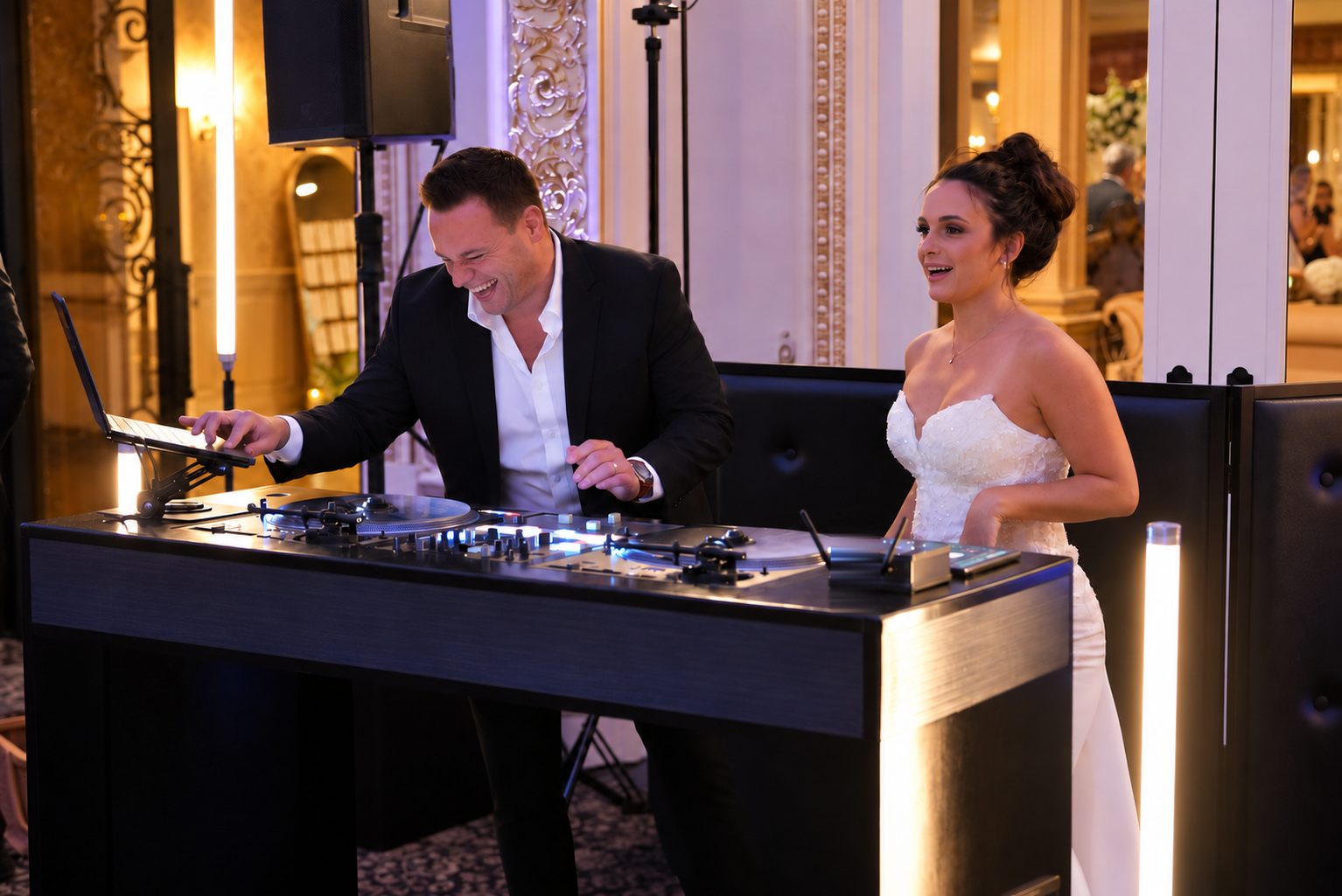 Nick Spinelli mixing at the decks while the bride sings along beside him